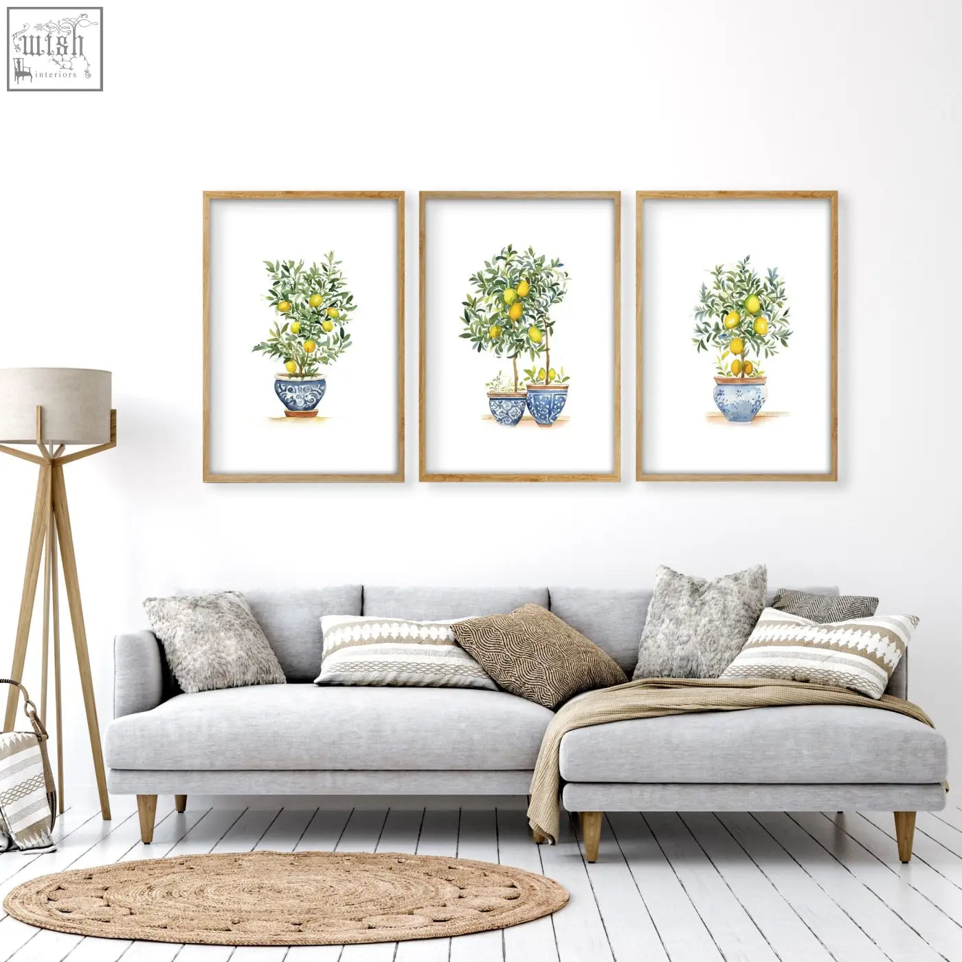 Three framed living room lemon tree art prints in blue and white ceramic pots with light wood frames