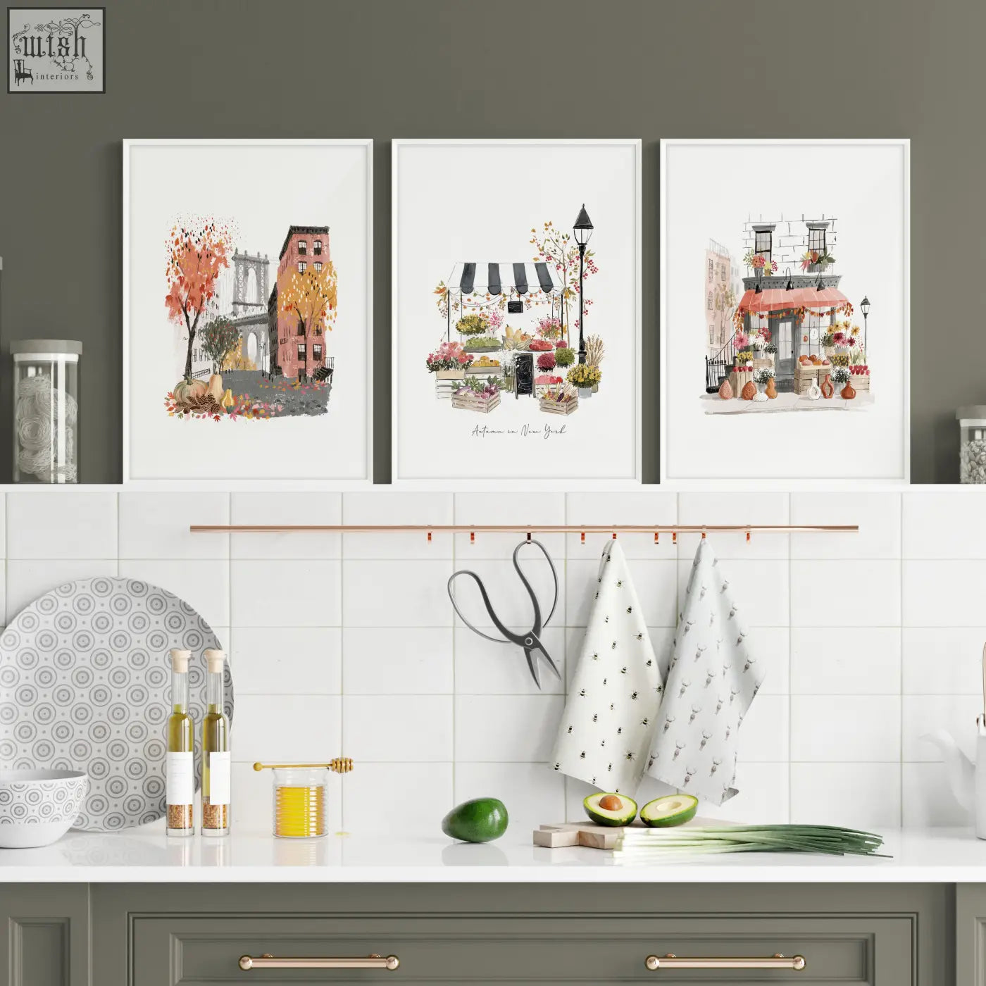 Three framed watercolor travel art prints of new york city scenes as wall hangings above a kitchen counter