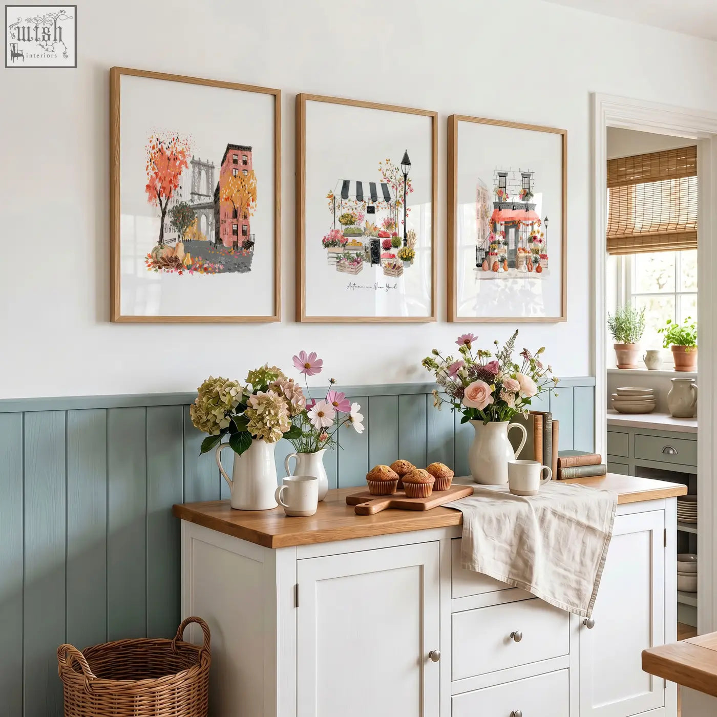 Three framed travel art prints with pastel urban scenes in light wood frames perfect as kitchen wall hangings
