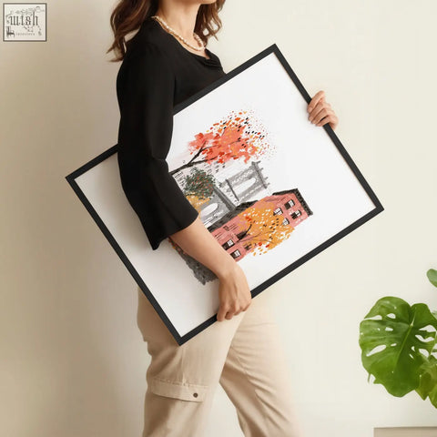Black-framed wall hangings featuring stylized autumn leaves, gray buildings, and a bridge in travel art prints set