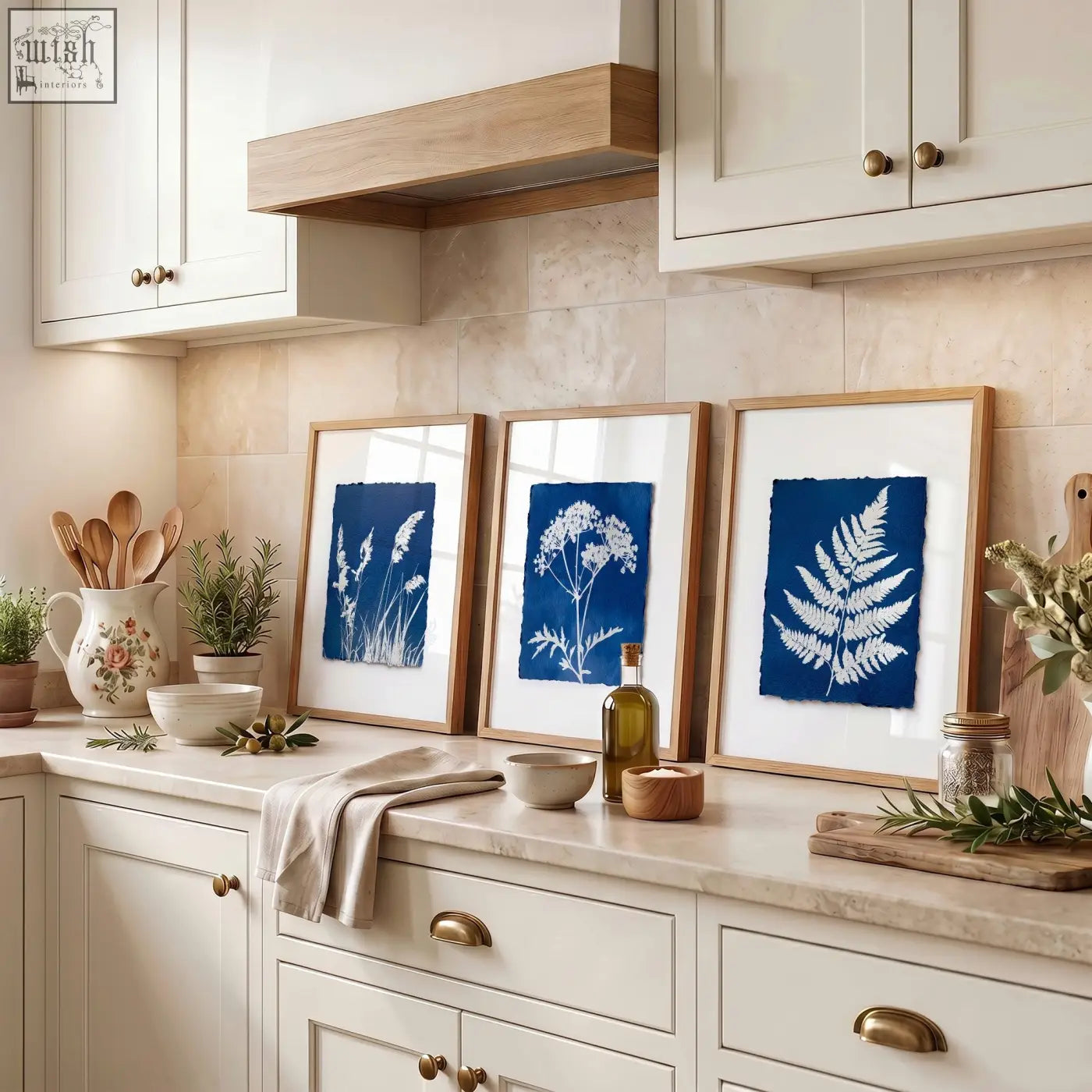 Three framed wall paintings featuring cyanotype botanical prints on deep blue paper in light wood frames for country cottage decor