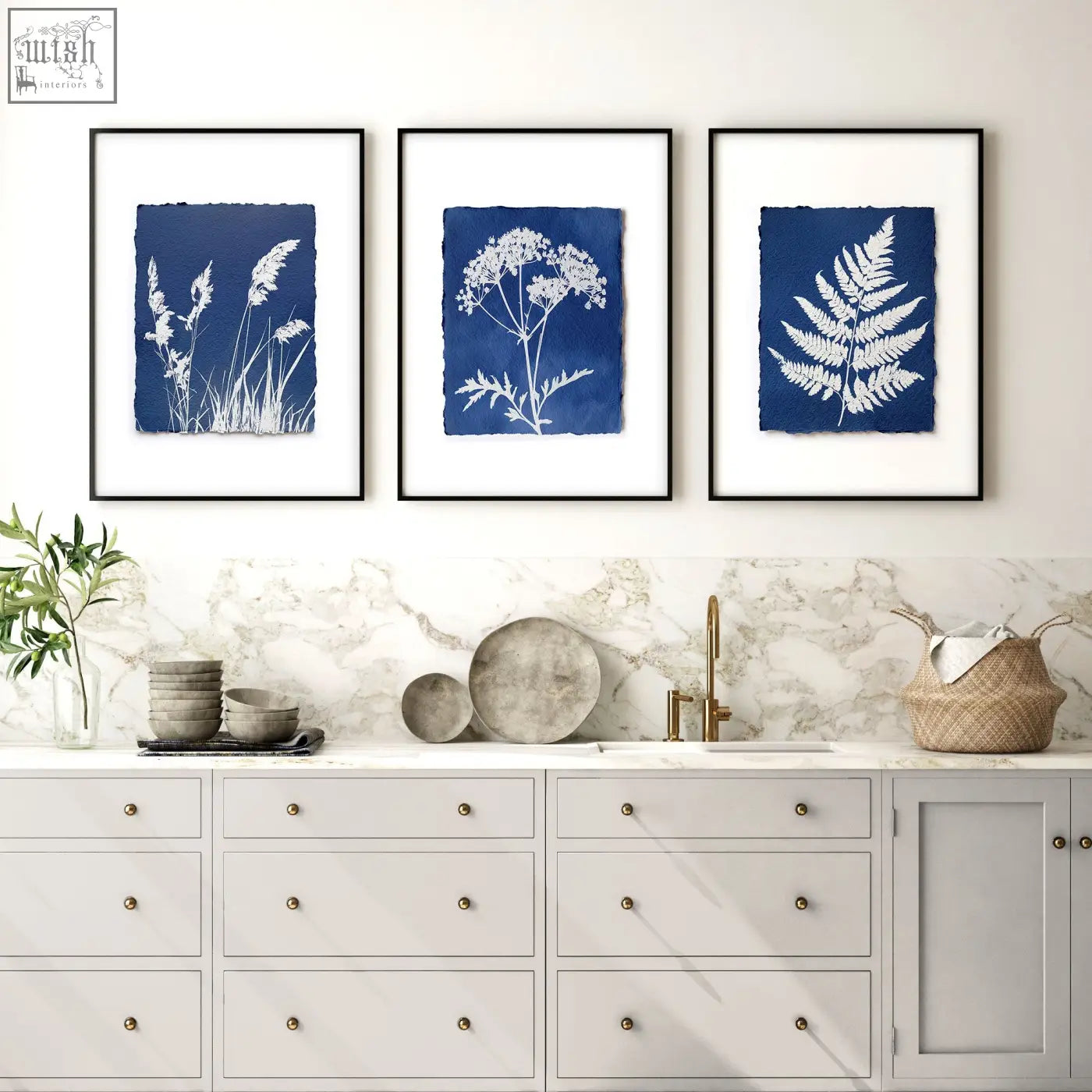 Three framed cyanotype botanical wall paintings with white plant silhouettes on deep blue paper for country cottage decor