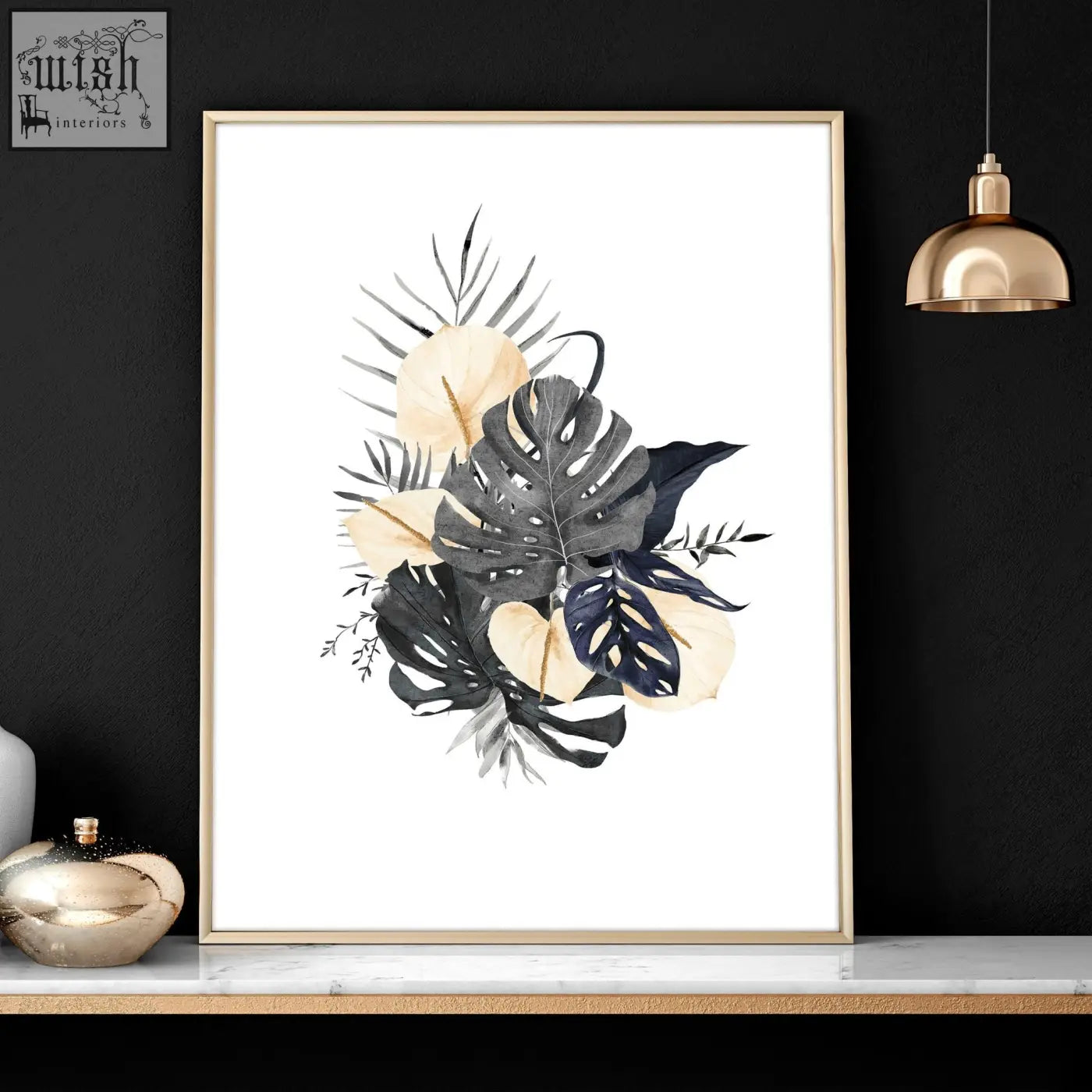 A set of 3 framed wall pictures featuring botanical wall art prints with monstera leaves in black navy and cream tones