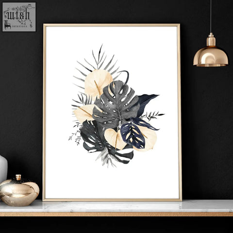A set of 3 framed wall pictures featuring botanical wall art prints with monstera leaves in black navy and cream tones