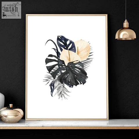 A set of 3 framed wall art prints featuring watercolor tropical leaves in black navy and cream for bedroom wall pictures