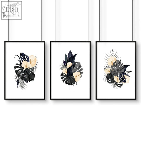Set of three black and cream tropical leaf wall pictures in minimalist frames perfect as wall art prints for bedroom