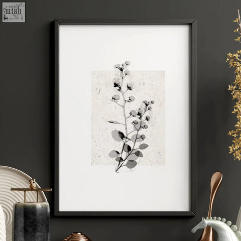 Black-framed wall picture with minimalist french country eucalyptus art print in grayscale on textured ivory paper