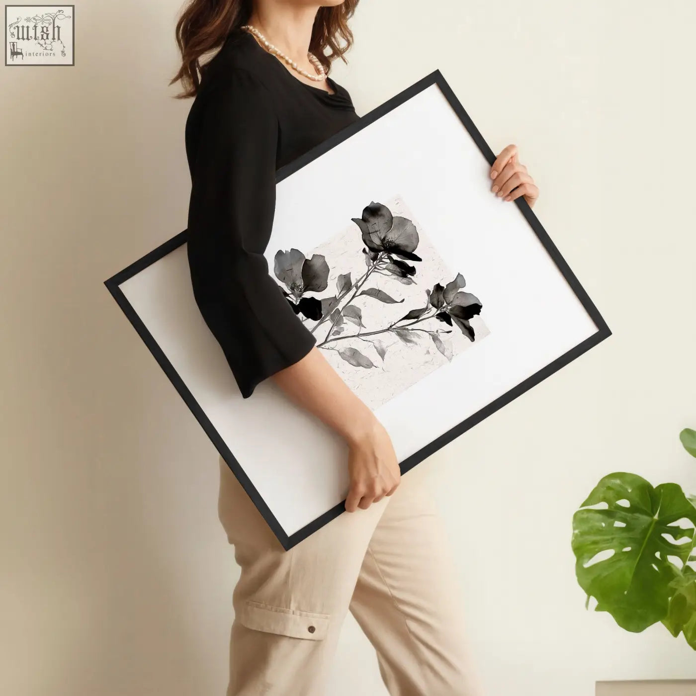 Black-framed wall pictures featuring minimalist french country art prints of dark floral botanical designs on white background