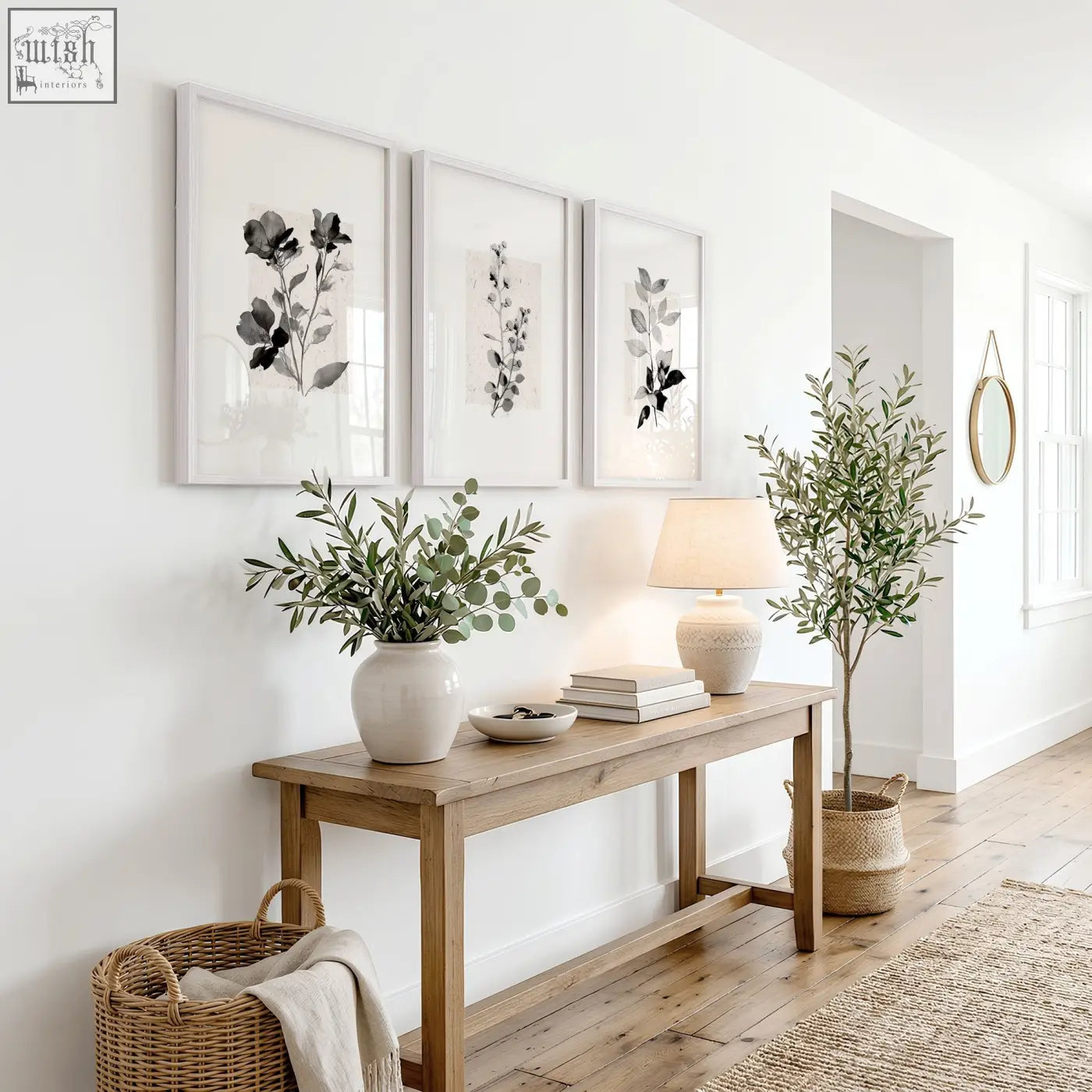 A white ceramic vase with eucalyptus branches complements french country wall pictures art prints in ivory grey tones