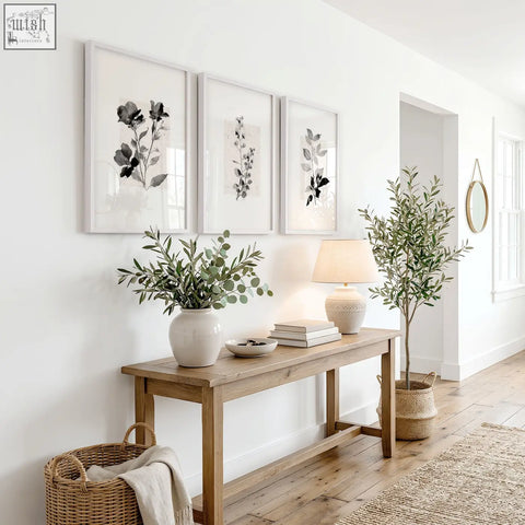 A white ceramic vase with eucalyptus branches complements french country wall pictures art prints in ivory grey tones