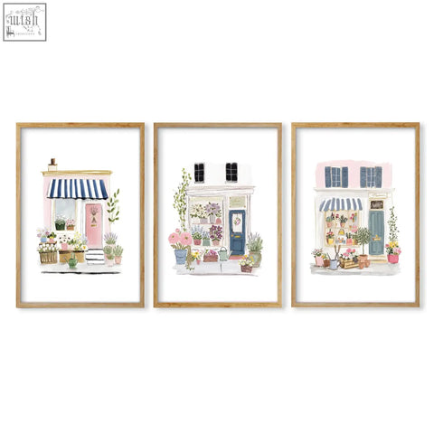 Three framed wall prints blue flower shop illustrations with pastel facades perfect for dining room decor