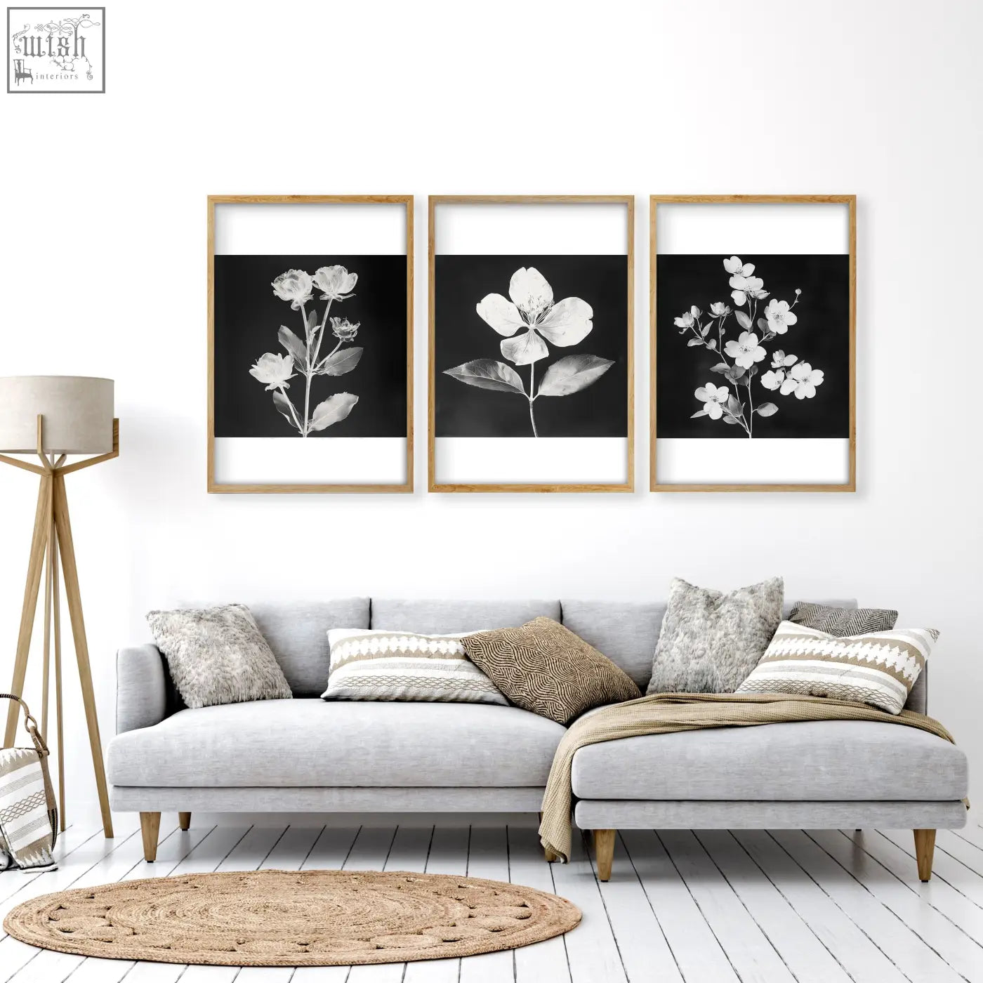 Three framed wall prints with black and white botanical florals in light wood frames for french country living room decor