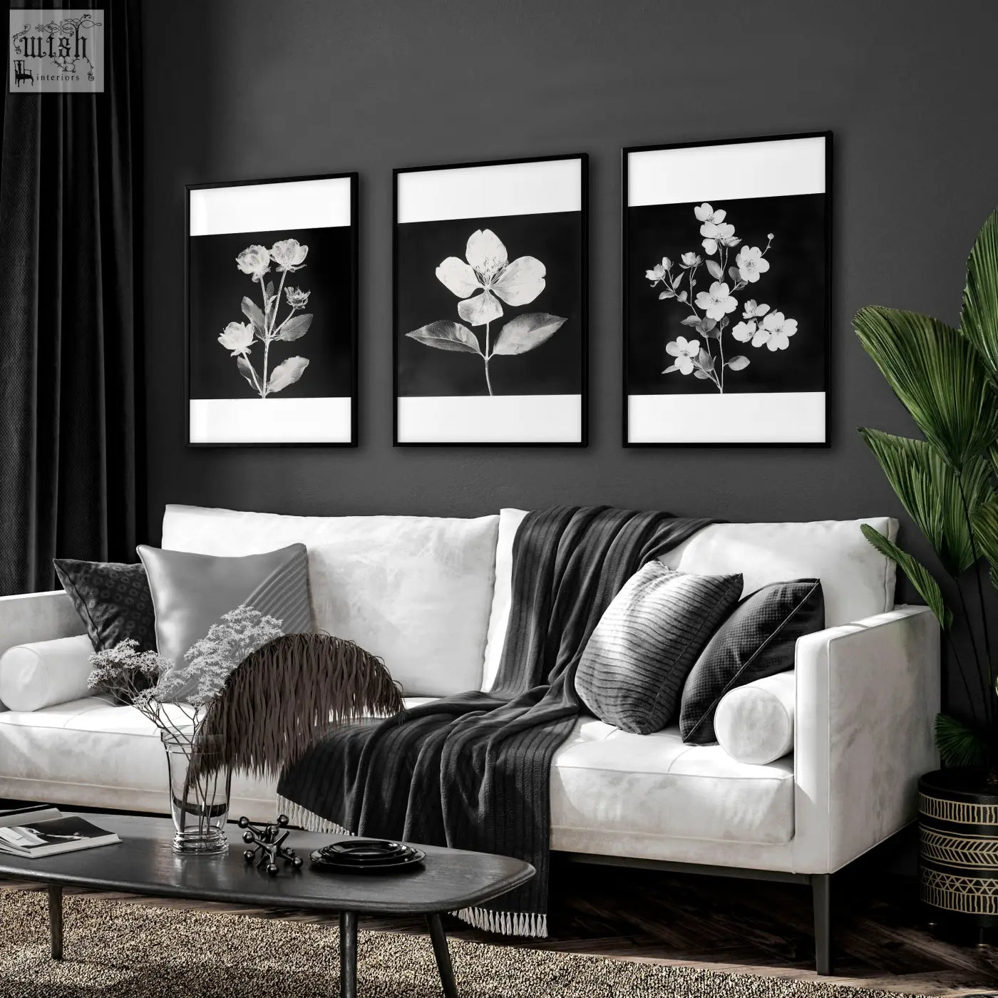 Three black-and-white floral wall prints with white borders in sleek black frames perfect for living room french country decor