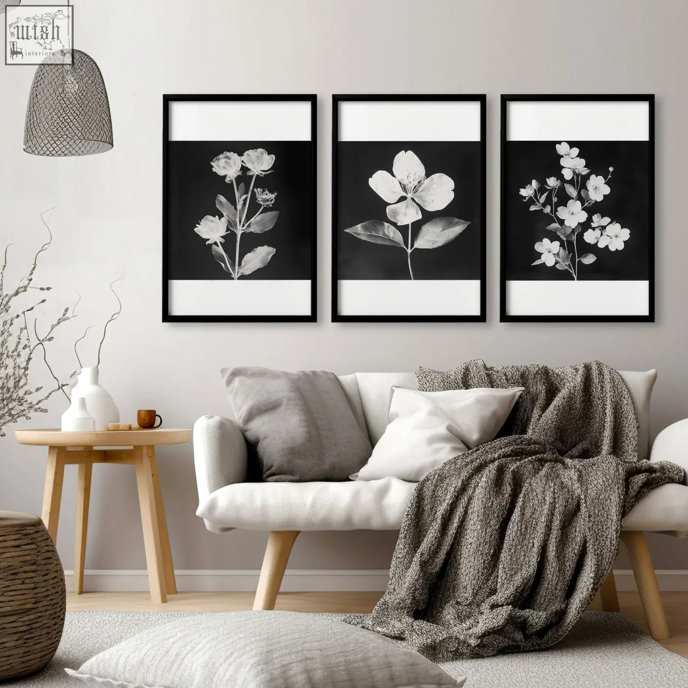 Three black framed wall prints featuring white botanical floral art for living room in french country style