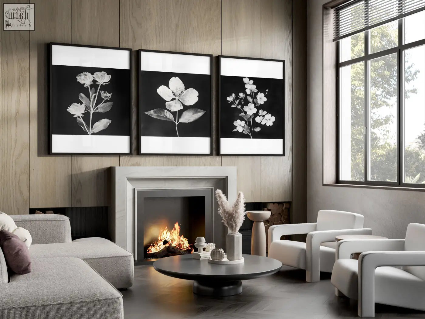 Three black frames with white botanical floral prints displayed above a fireplace for a french country living room