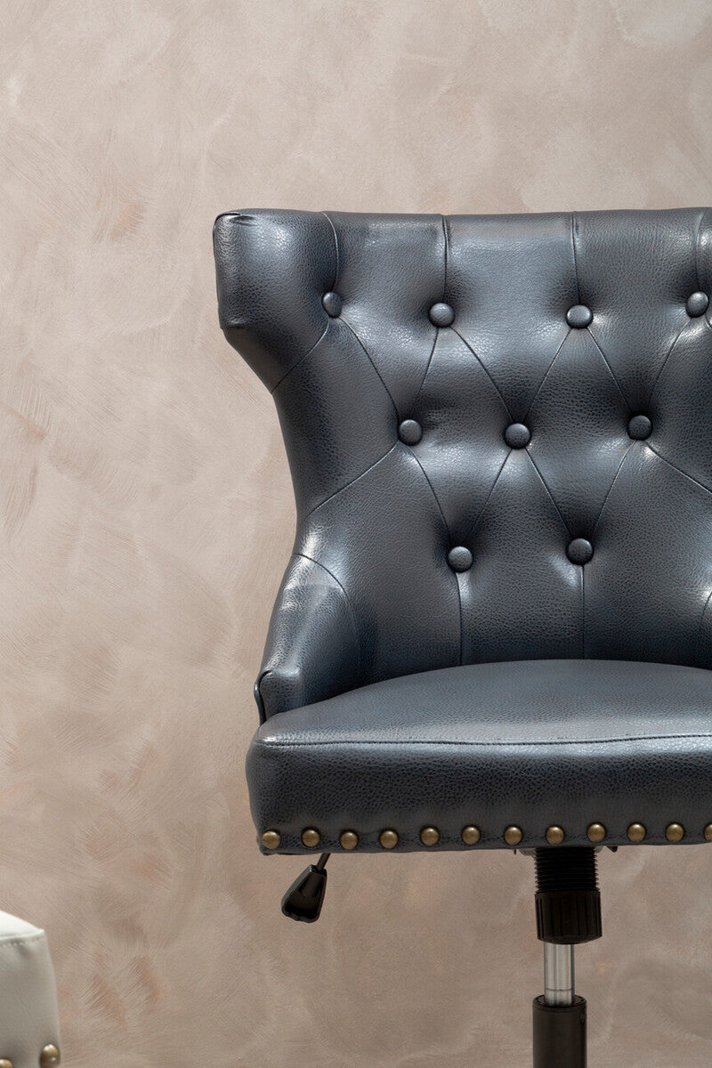Dark gray tufted black leather effect home office chair with brass nailhead trim for stylish leather effect home use
