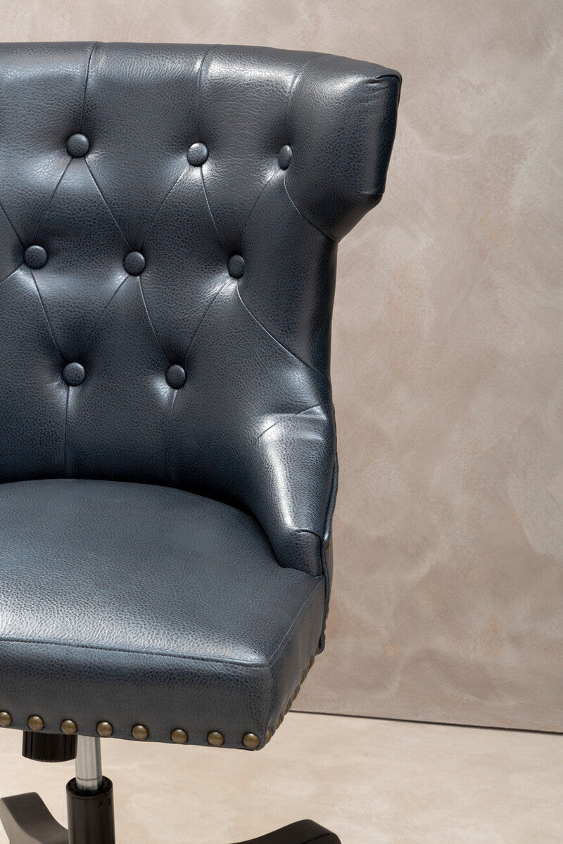 Dark blue tufted leather effect home office chair with brass nailhead trim designed for stylish workspace seating