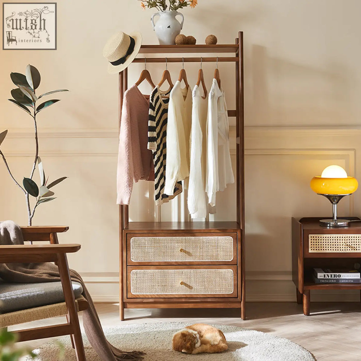 A walters clothes rack made of wood with a warm brown finish featuring woven cane drawers and garment hanging space