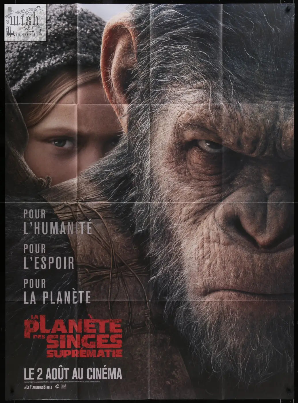 A close-up of a realistic chimpanzee face on the original french panel movie poster for war for the planet of the apes featuring andy serkis