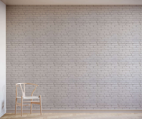 A minimalist white wooden chair with a curved backrest and slender legs from warehouse shown from the back side