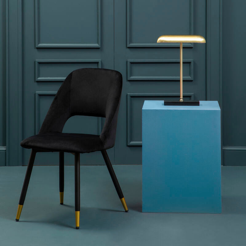 Warren black velvet dining chair with black velvet upholstery and stylish gold tipped legs for elegant dining spaces