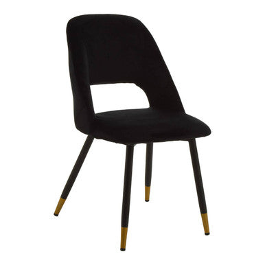 Warren black velvet dining chair featuring soft black velvet upholstery and stylish gold-tipped legs