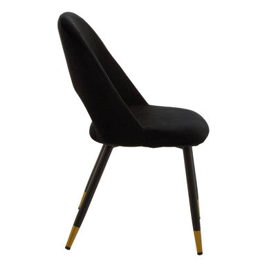 Warren black velvet dining chair with sleek tapered legs and gold finished tips in black velvet upholstery