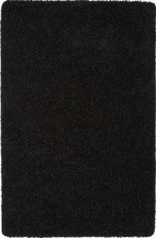 Black plush washable black shaggy rug with soft dense pile and slightly frayed edges for cozy spaces