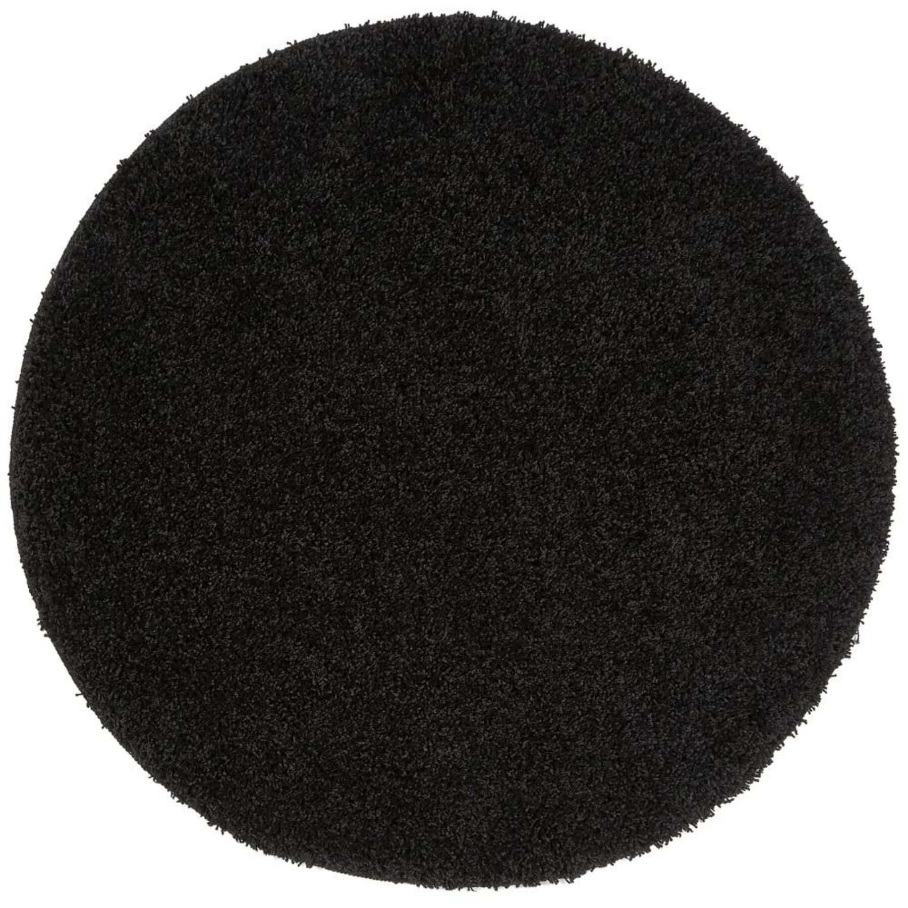 Black circular washable black shaggy rug with plush textured surface perfect for cozy home spaces