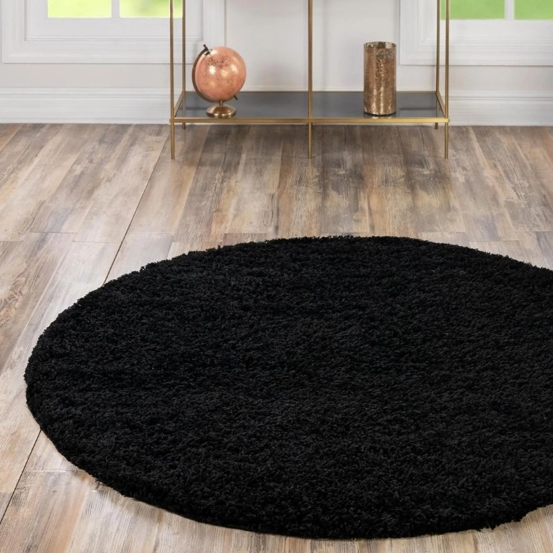 Washable black shaggy round rug with soft shaggy texture perfect for cozy living spaces
