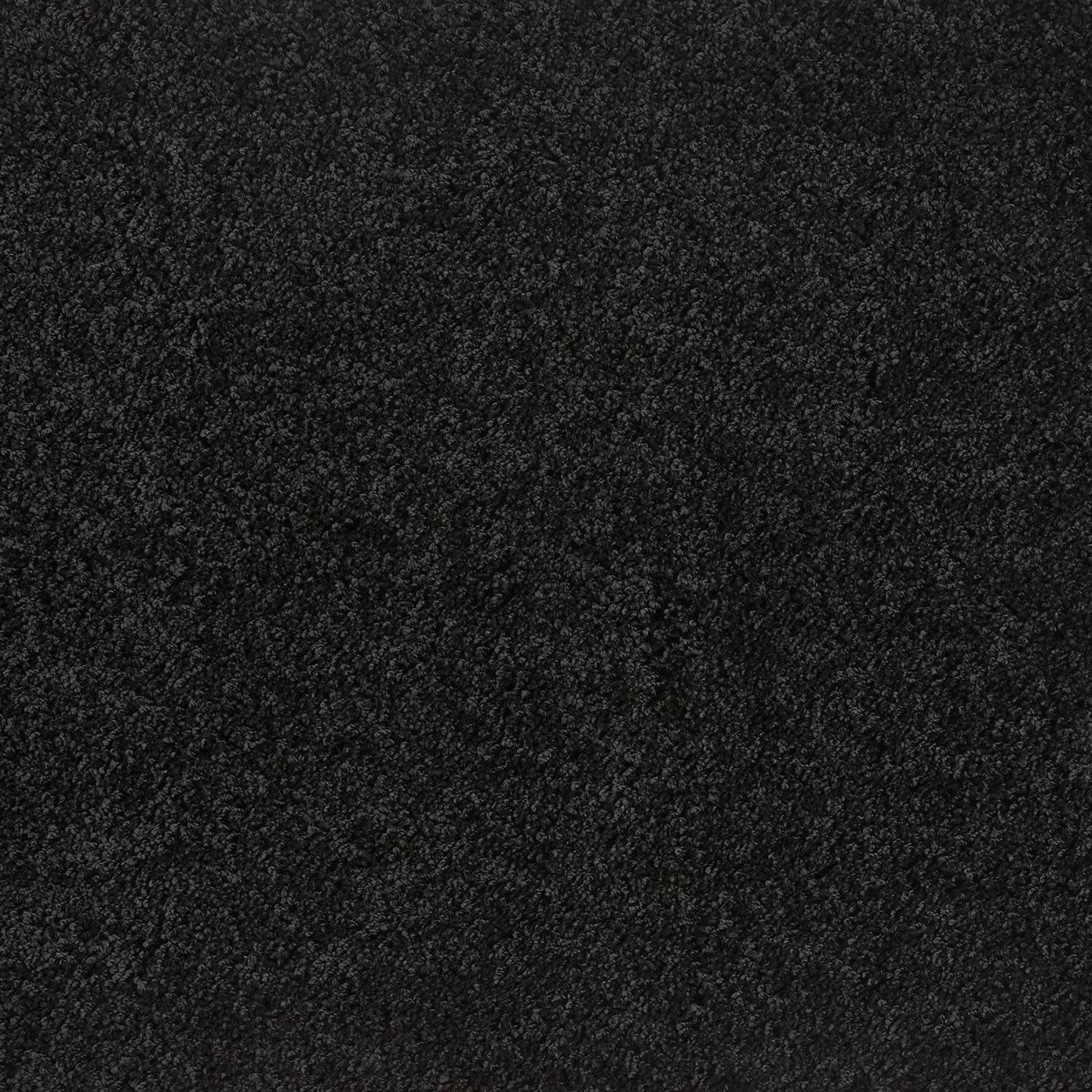 Black shaggy rug with dense plush pile in washable black textured material for cozy indoor use