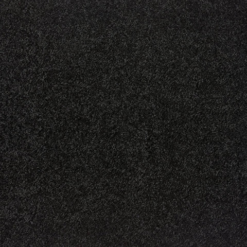 Black shaggy rug with dense plush pile in washable black textured material for cozy indoor use