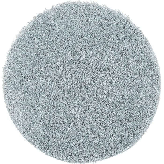 A plush washable blue shaggy rug with a circular shape and soft textured surface perfect for cozy spaces