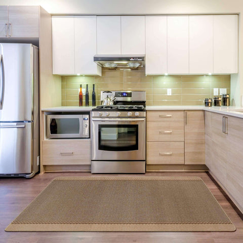 Beige washable bordered rug with woven diamond texture and scalloped edges perfect for easy cleaning