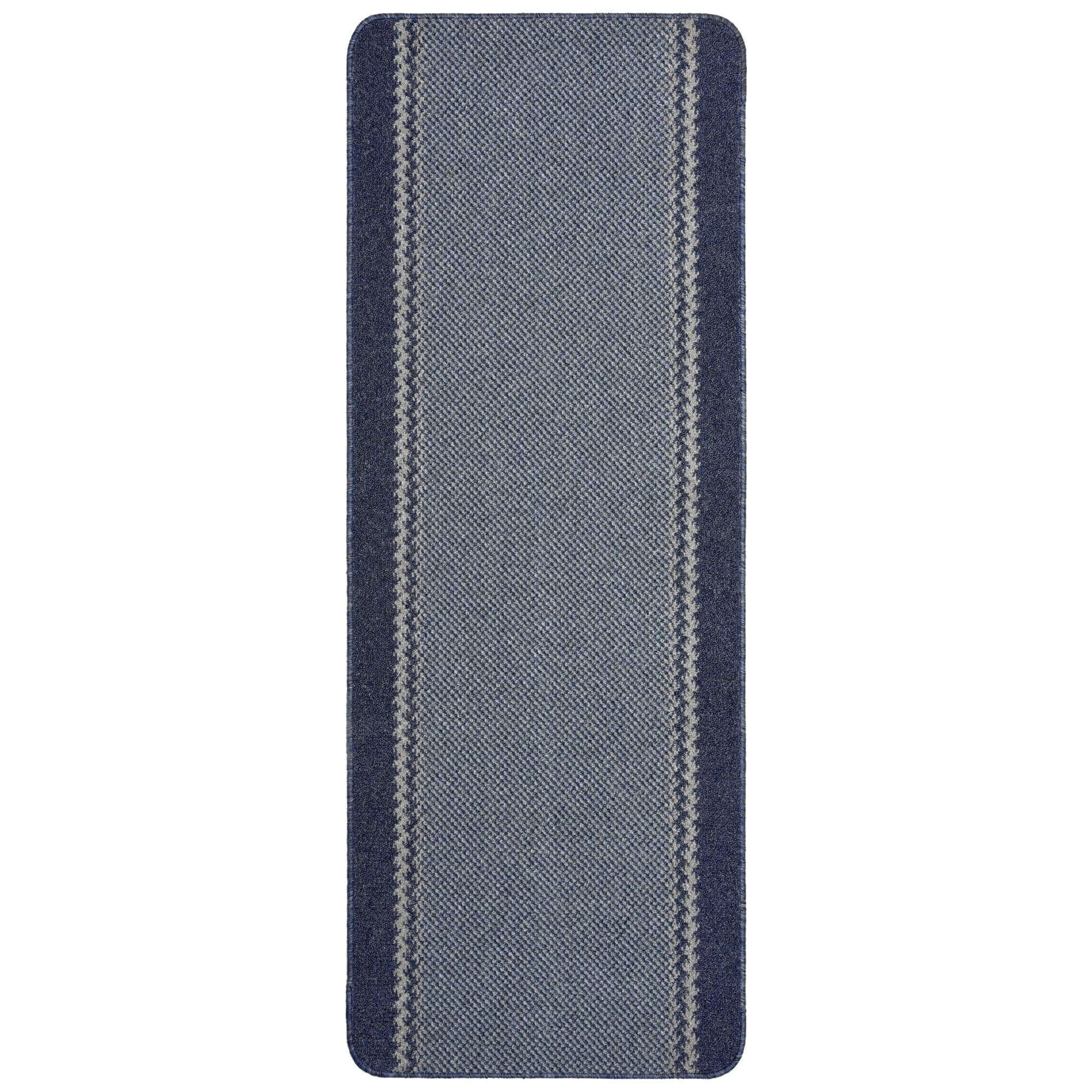 A washable bordered blue runner rug with navy and gray stripes and a textured woven pattern perfect for hallways
