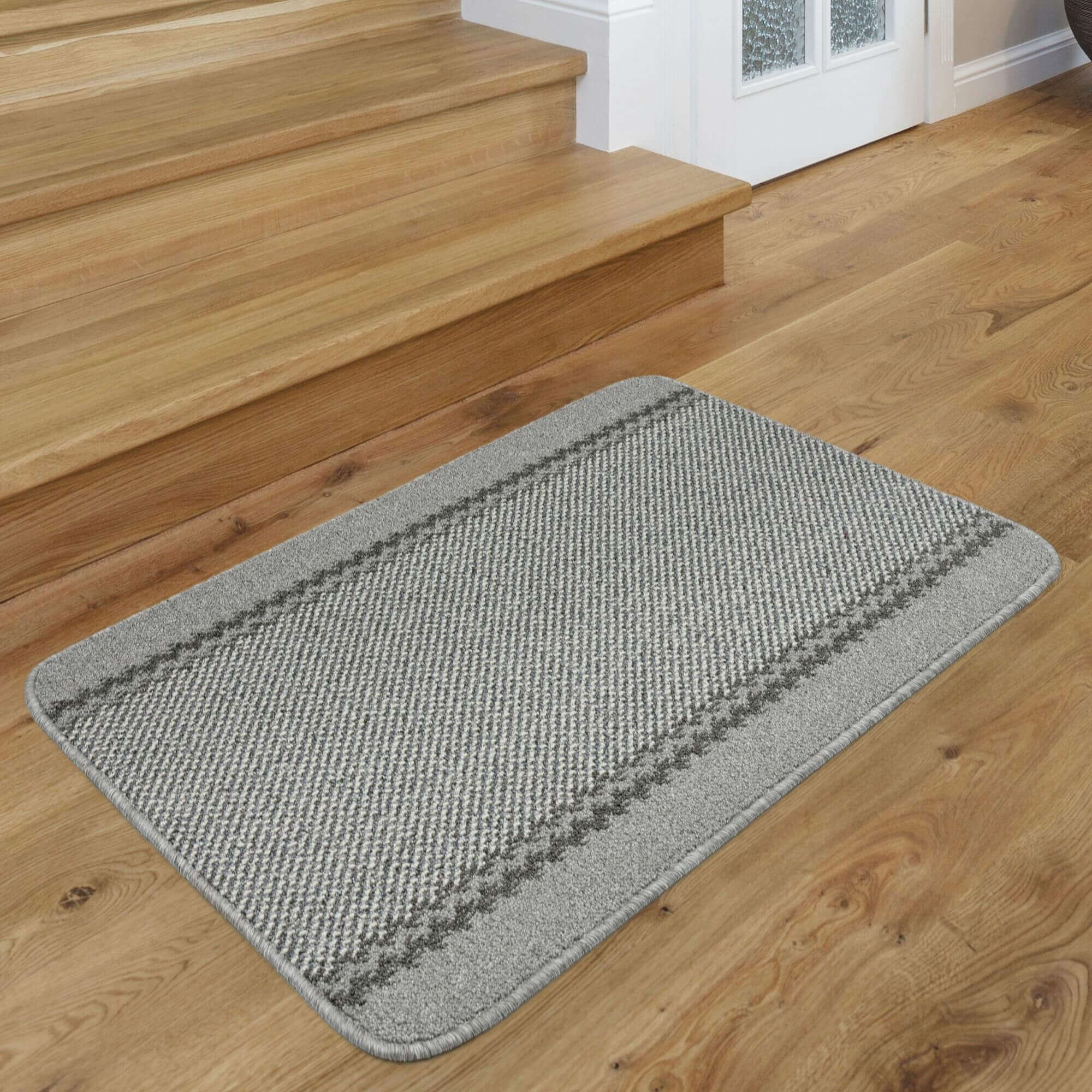 Gray rectangular washable designer bordered entrance mat with woven texture and darker gray border stripes