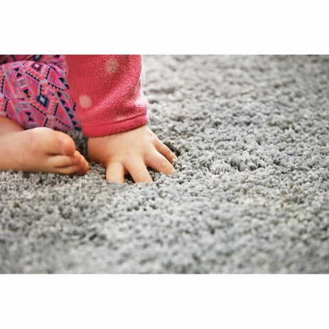 Soft gray plush carpet with dense fluffy texture in a washable ghost grey shaggy rug perfect for cozy spaces