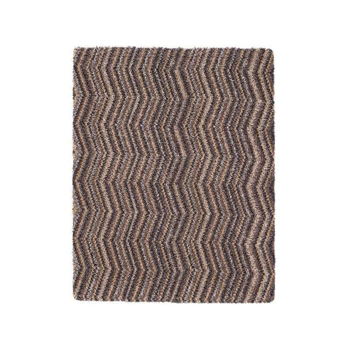 A rectangular plush washable mat with a textured chevron design in brown and beige multicolour shades