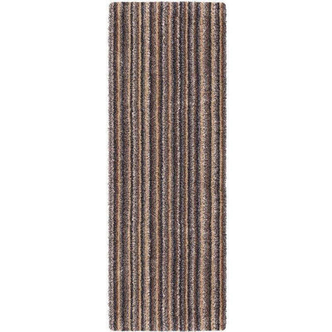 A plush washable mat and runner with a striped design in earthy brown and gray tones