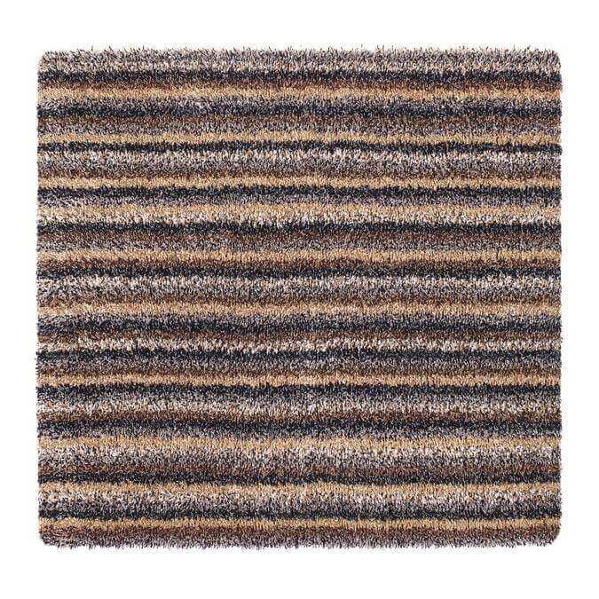 A plush shaggy area rug with a washable striped design in earthy brown beige and dark gray tones