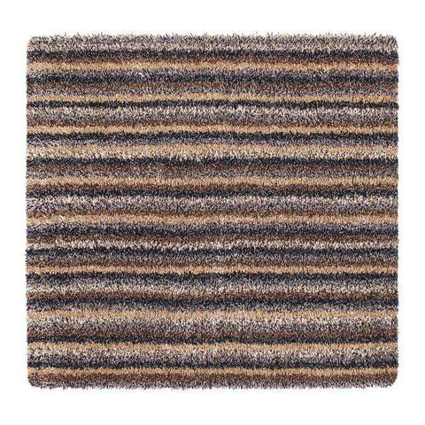 A plush shaggy area rug with a washable striped design in earthy brown beige and dark gray tones
