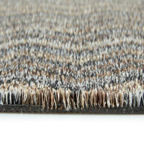 Beige and gray washable mats with a plush woven fiber surface featuring a chevron design pattern