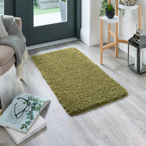A washable olive green shaggy rug with a soft plush textured surface perfect as a green shaggy rug for any room