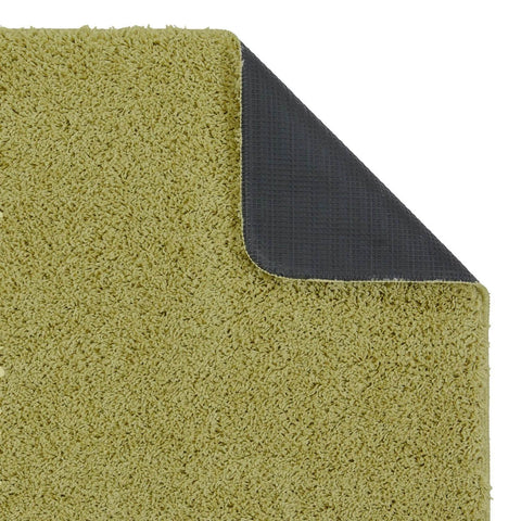 Washable olive green shaggy rug with soft plush pile and dark gray non-slip backing for bathroom use