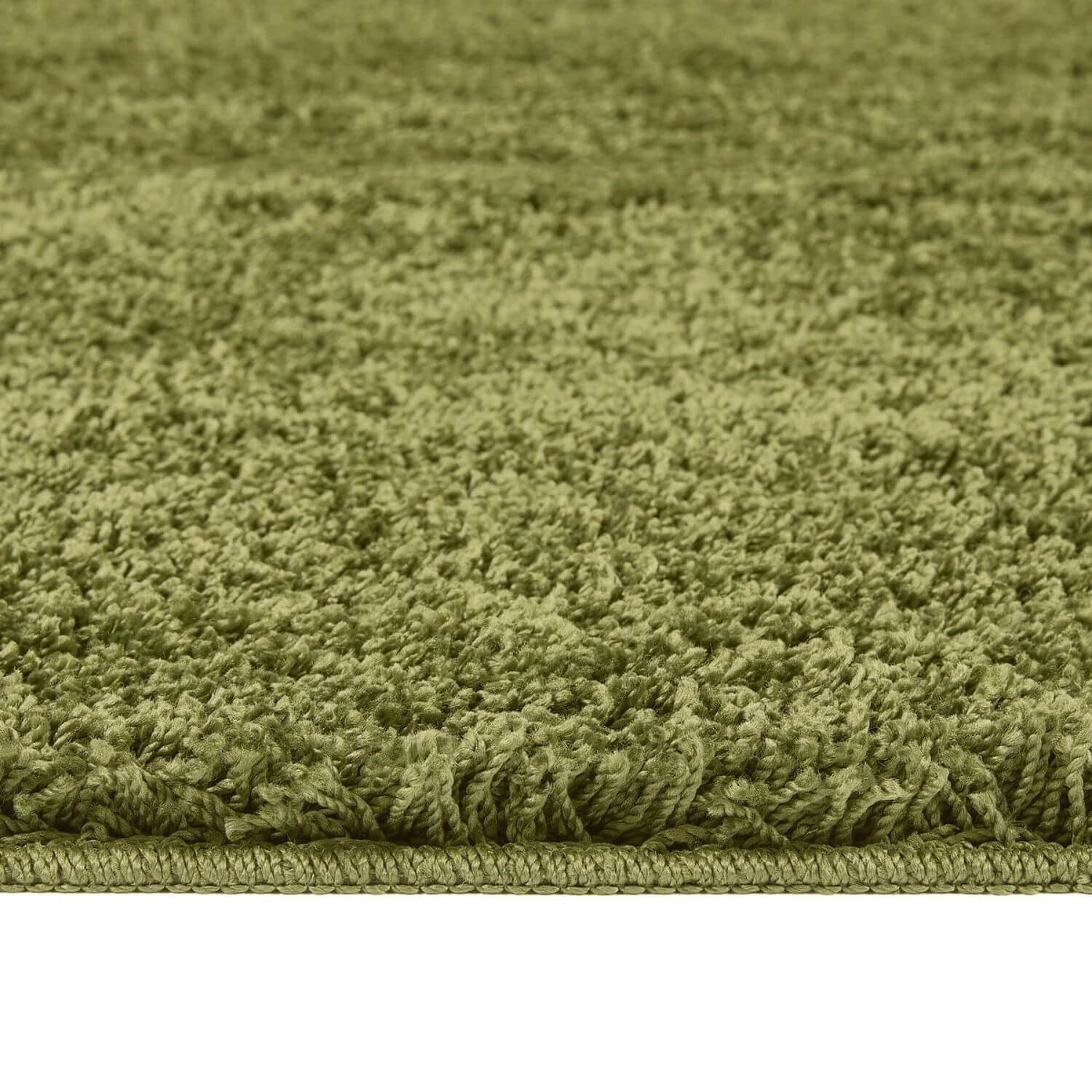Olive green shaggy bath mat with dense plush texture and washable fabric perfect for bathroom use