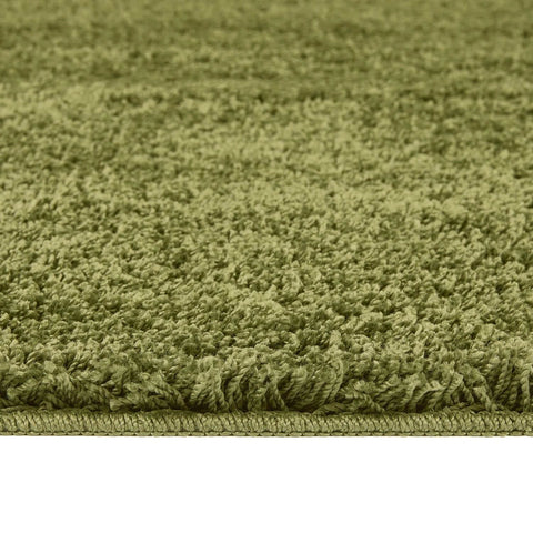 Olive green shaggy bath mat with dense plush texture and washable fabric perfect for bathroom use