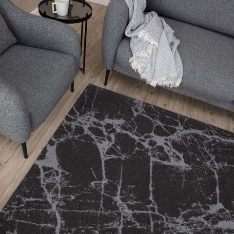 Dark grey washable rug carina with black and gray marble pattern and textured woven surface for easy cleaning