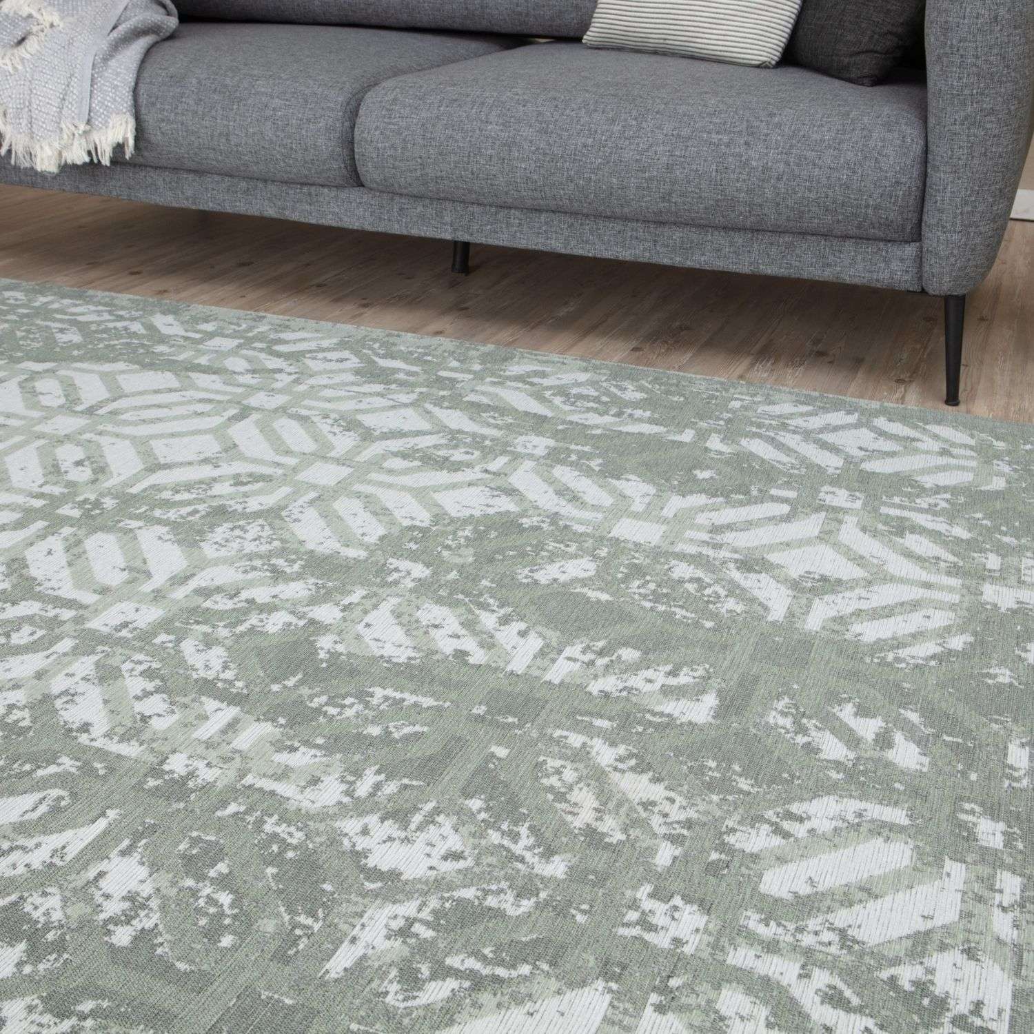 Soft gray washable rug carina green with subtle white and light green geometric pattern and textured weave