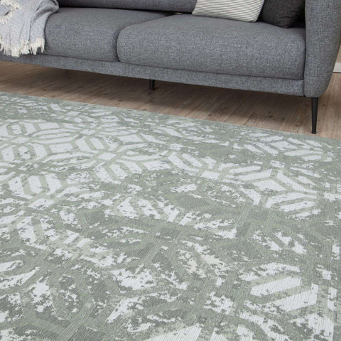 Soft gray washable rug carina green with subtle white and light green geometric pattern and textured weave