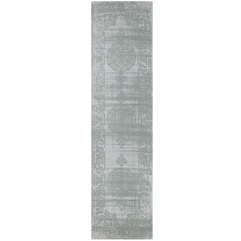 A long slender washable rug carina green in faded gray with vintage patterns and subtle distressing perfect for hallways